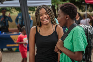 Teens laughing together at National Night Out in Jesse Allen Park