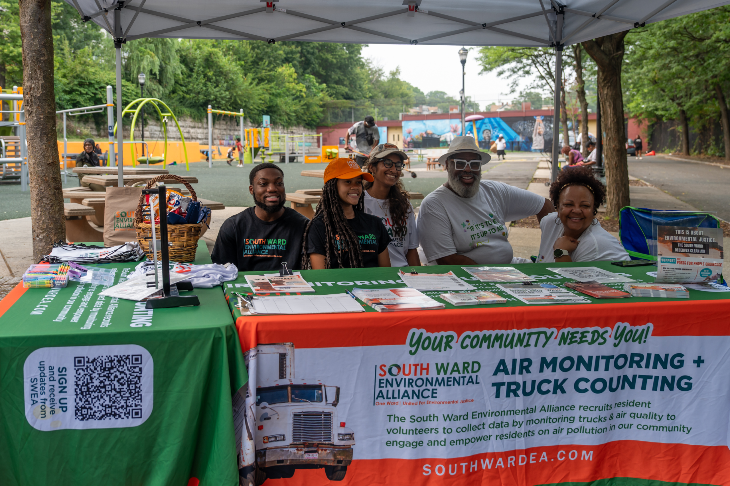 Community members and volunteers gathered at an outreach table during National Night Out.