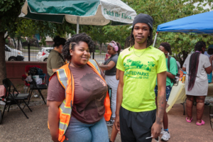Park Rangers Environmental Enrichment Program volunteer engaging with the community at a Newark park event