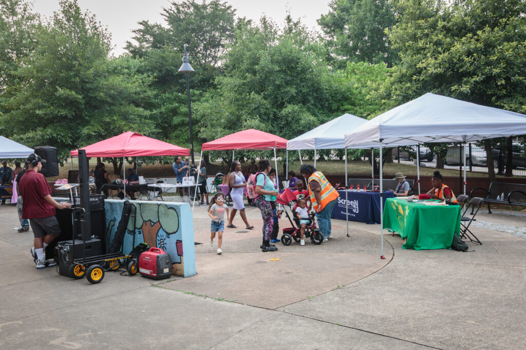 Community event tents set up throughout Jesse Allen Park